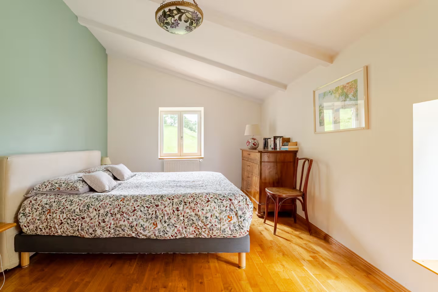Bedroom 1, queen bed and sea-green wall