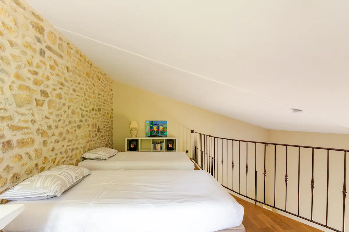 The two single beds on the mezzanine