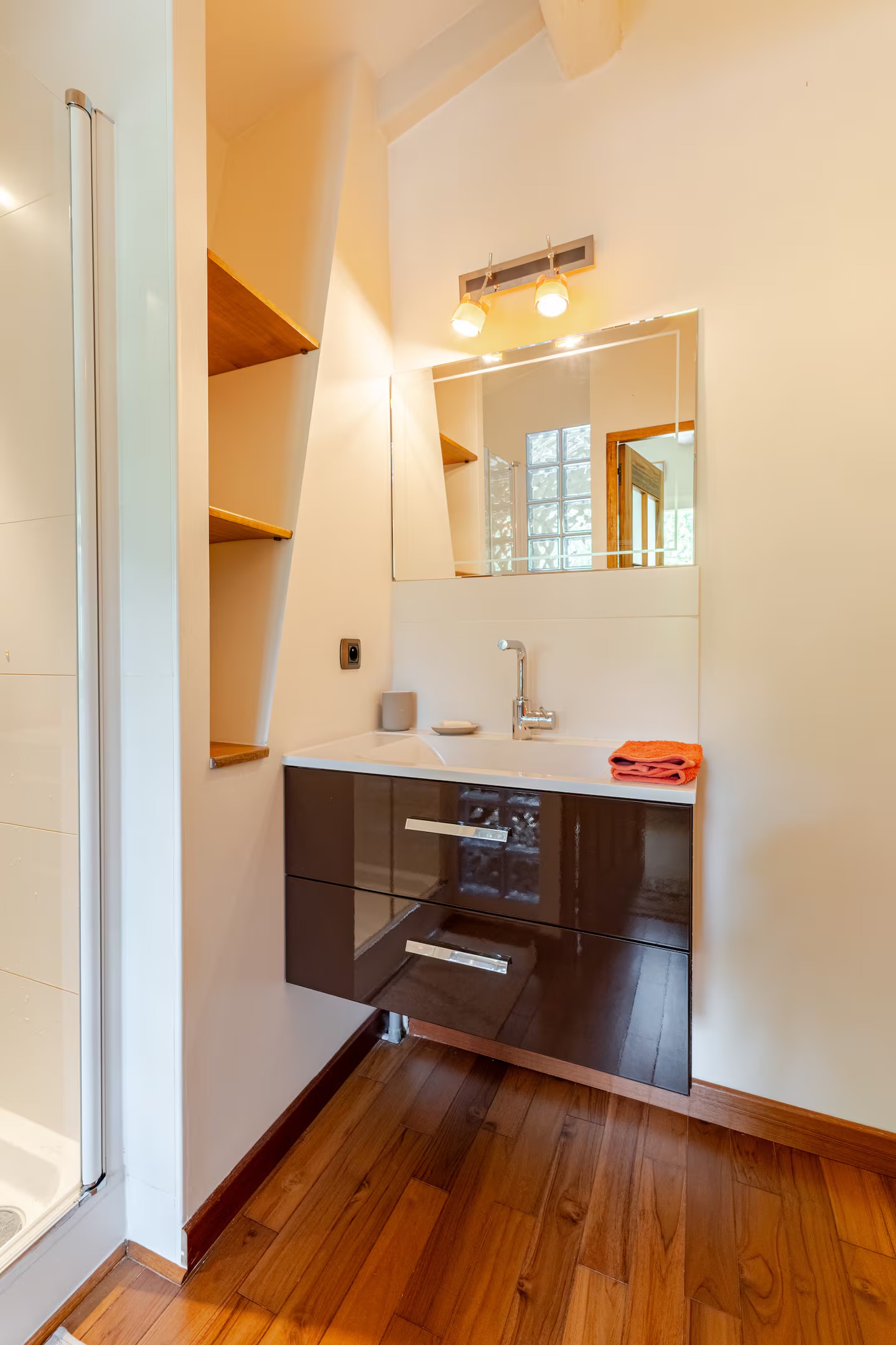 The private bathroom of bedroom 3, vanity and shower