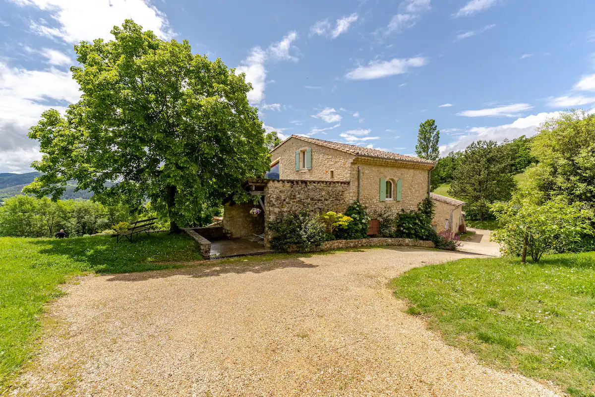 The farmhouse entrance and its gravel driveway