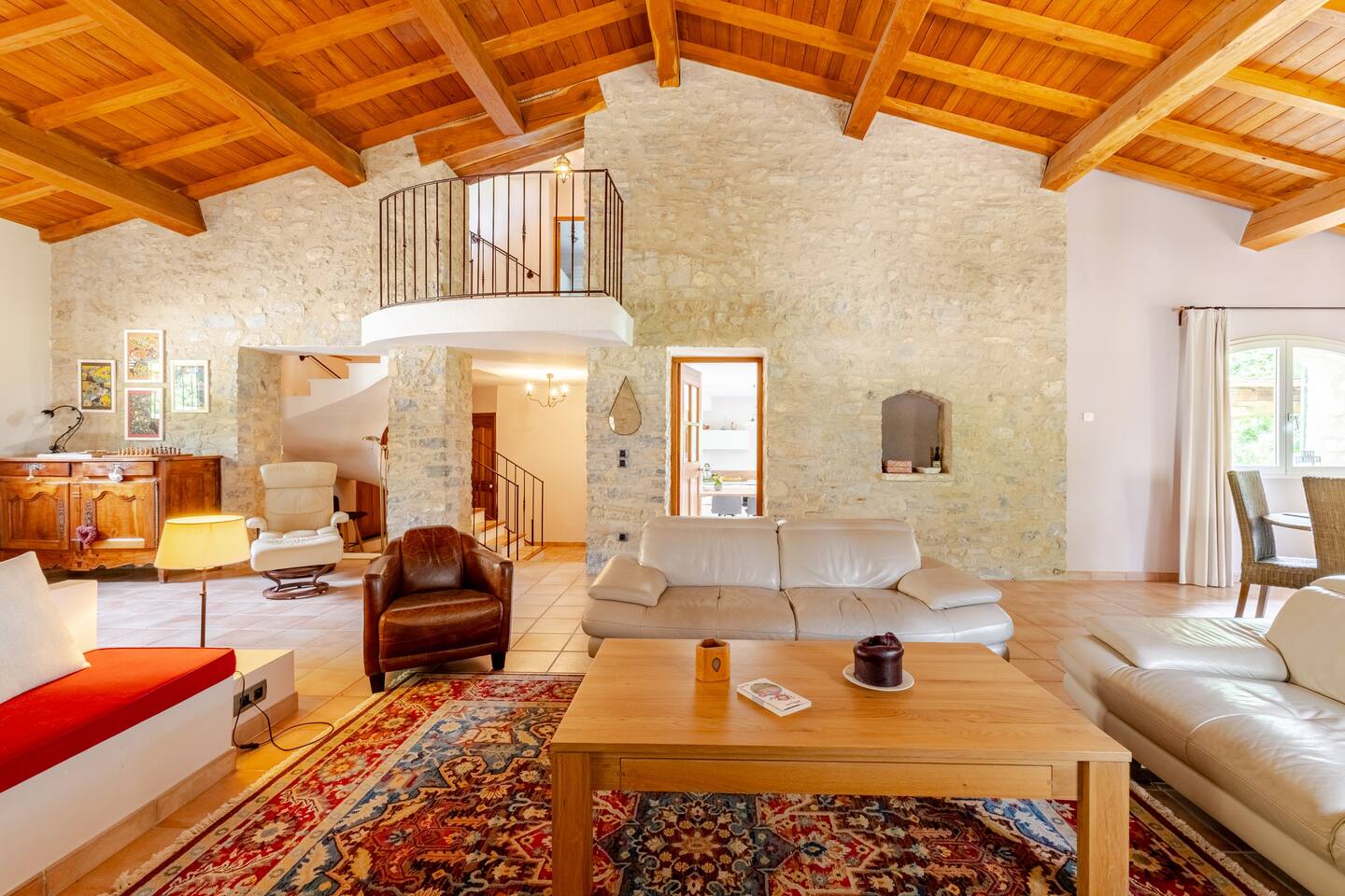 The living room under the timber roof and its mezzanine